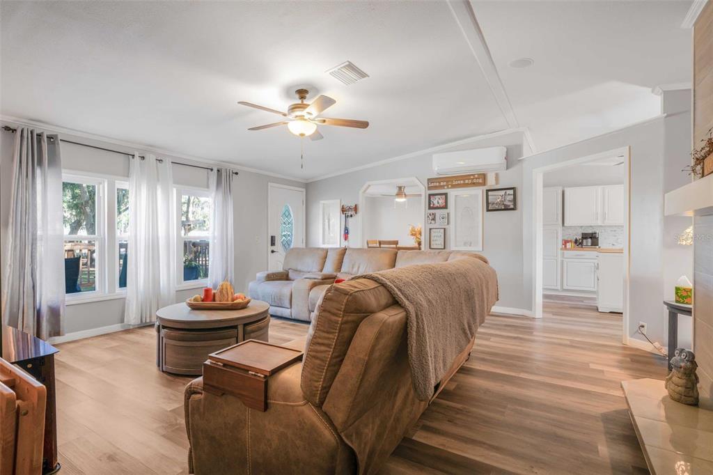 6716 West Riverbend Road Dunnellon, FL 34433 - Photo 16 of 75 a living room with furniture a couch and a chandelier