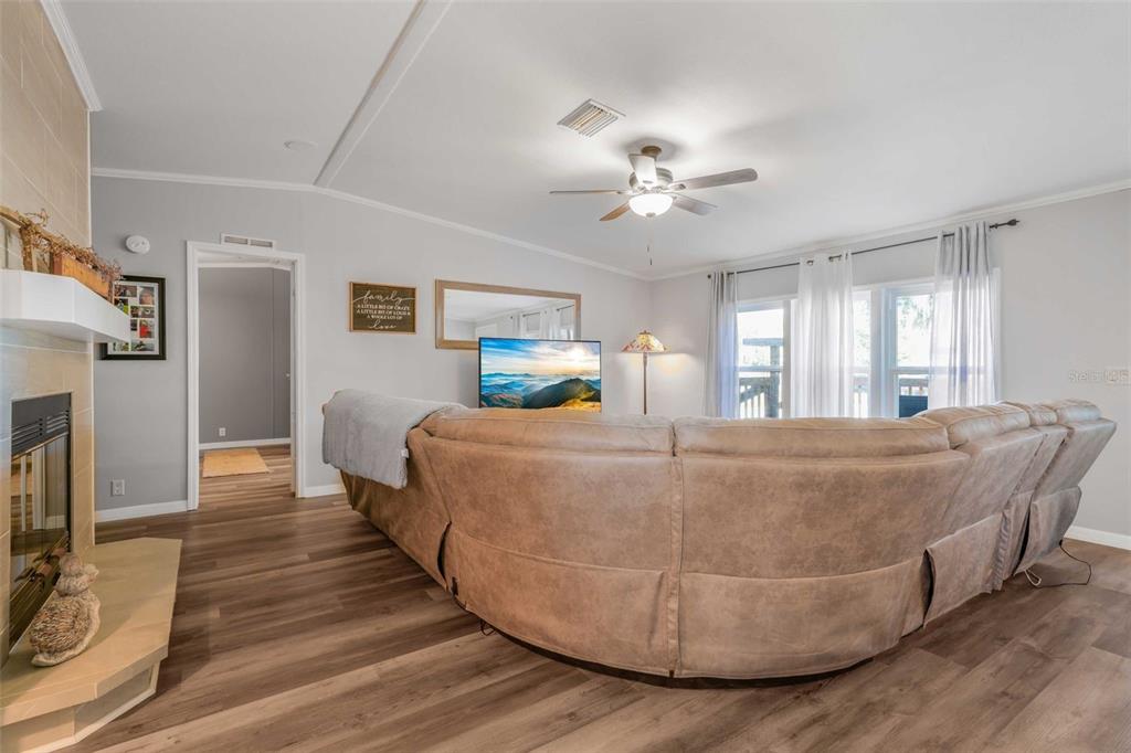 6716 West Riverbend Road Dunnellon, FL 34433 - Photo 18 of 75 a bed room with a bed and a chandelier