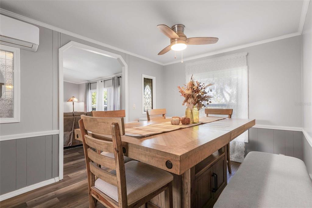 6716 West Riverbend Road Dunnellon, FL 34433 - Photo 22 of 75 a view of a dining room with furniture and wooden floor