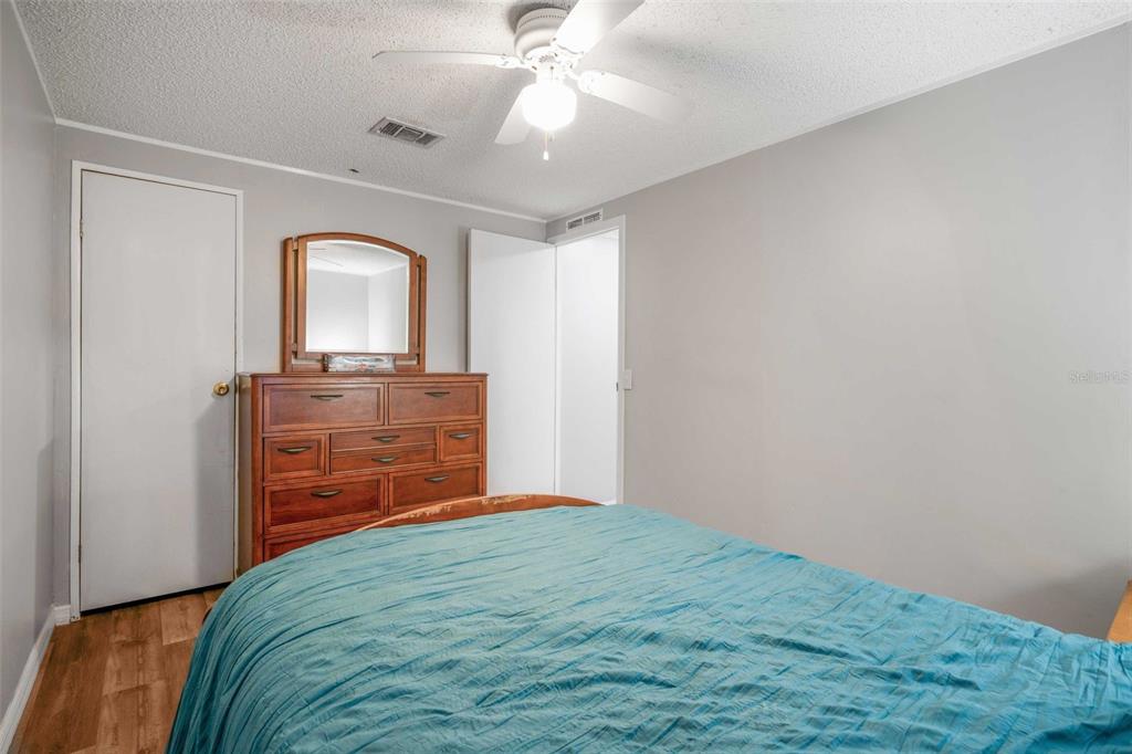 6716 West Riverbend Road Dunnellon, FL 34433 - Photo 34 of 75 a bedroom with a bed and a dresser