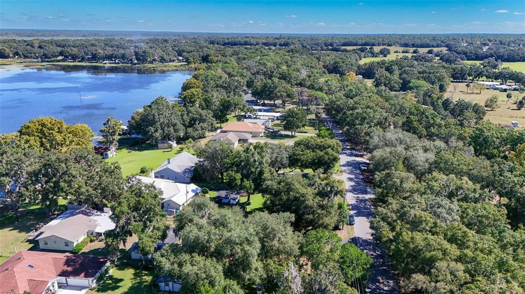 6716 West Riverbend Road Dunnellon, FL 34433 - Photo 75 of 75 an aerial view of a houses with a yard and lake view