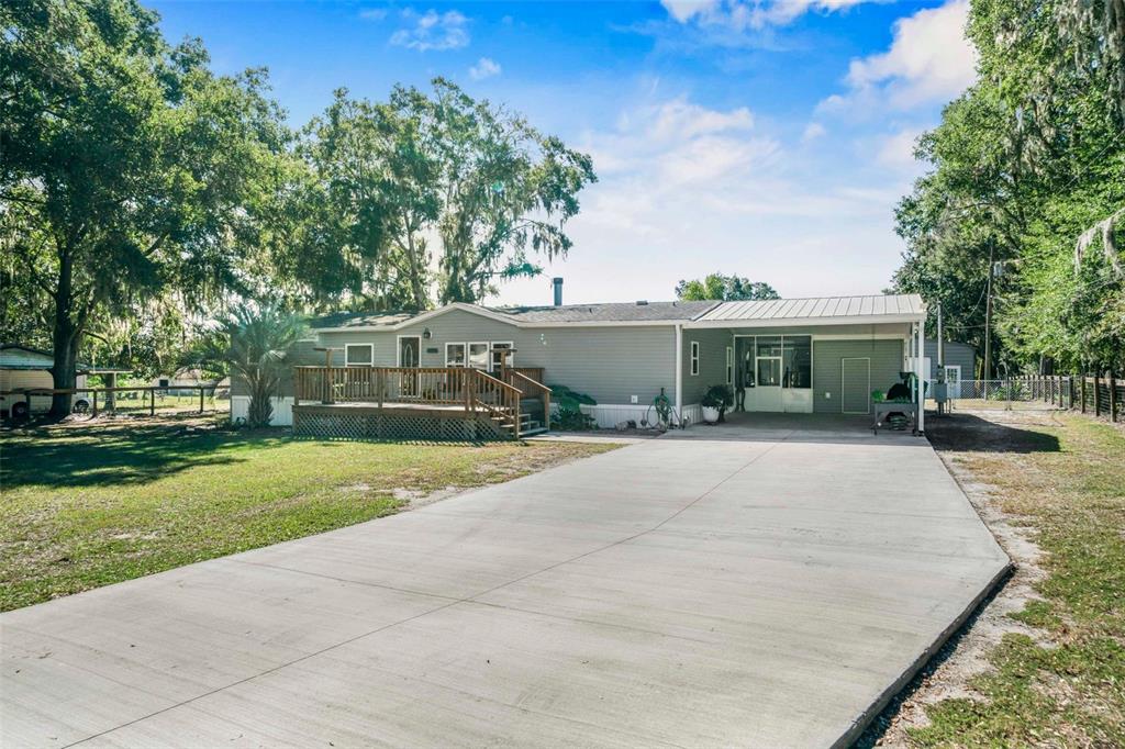 6716 West Riverbend Road Dunnellon, FL 34433 - Photo 9 of 75 front view of a house with a yard