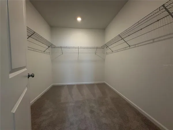 a view of a room with racks on the wall