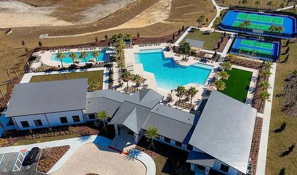 an aerial view of a house with a ocean view