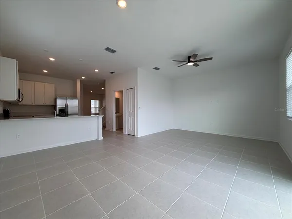 a view of a kitchen with a sink and cabinets