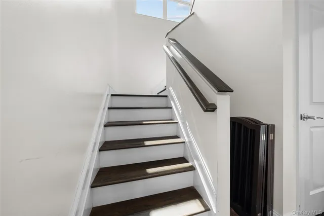 a bathroom with a sink toilet and a mirror