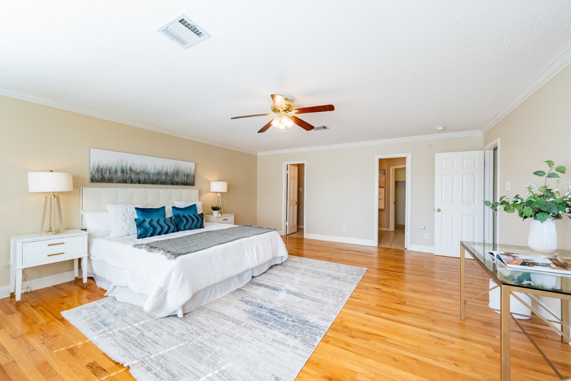 2017 Carriage Club Drive Cedar Park, TX 78613 - Photo 23 of 35 a living room with a bed furniture and a potted plant