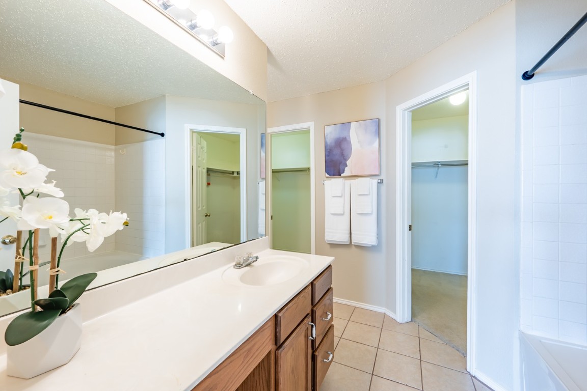 2017 Carriage Club Drive Cedar Park, TX 78613 - Photo 24 of 35 a bathroom with a sink and a mirror