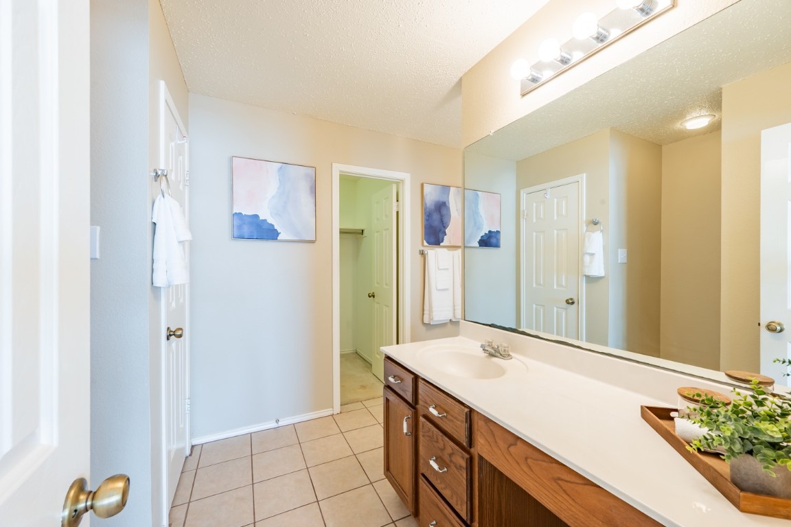 2017 Carriage Club Drive Cedar Park, TX 78613 - Photo 25 of 35 a bathroom with a sink and a mirror