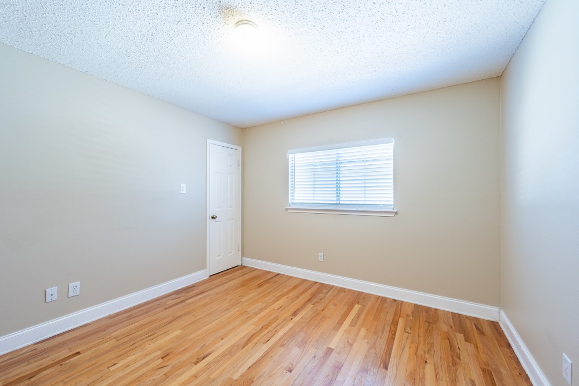 2017 Carriage Club Drive Cedar Park, TX 78613 - Photo 31 of 35 a view of a room with wooden floor and white walls