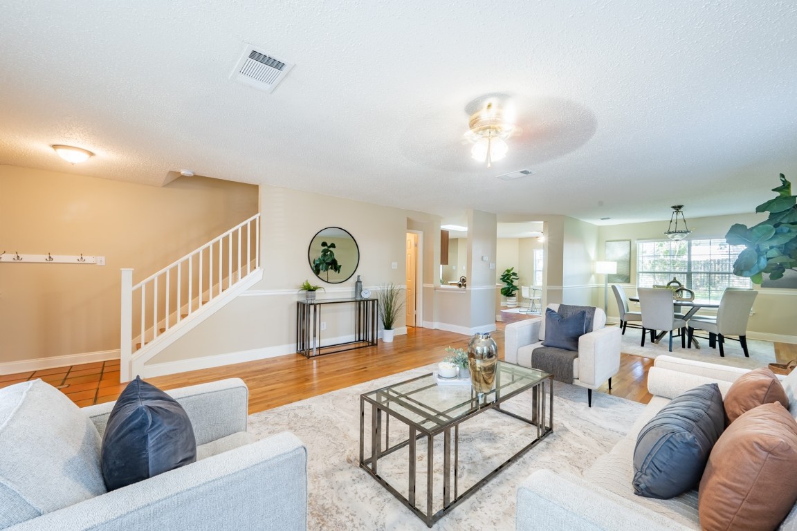 2017 Carriage Club Drive Cedar Park, TX 78613 - Photo 5 of 35 a living room with furniture and a dining table