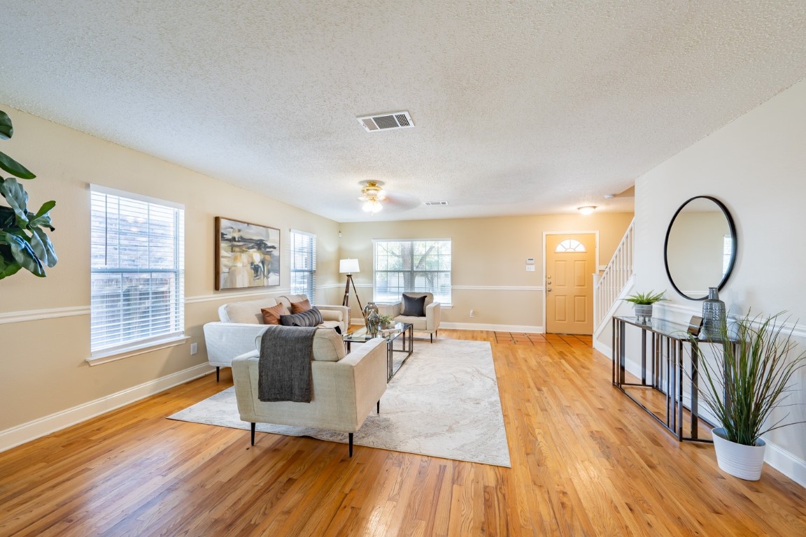 2017 Carriage Club Drive Cedar Park, TX 78613 - Photo 6 of 35 a living room with furniture a wooden floor and a window