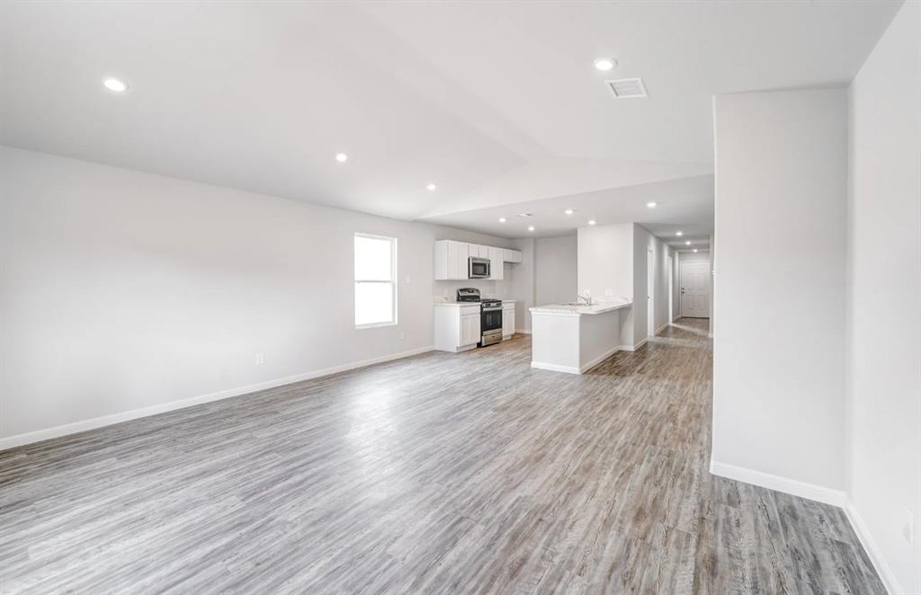 350 Azalea Trail Granbury, TX 76048 - Photo 6 of 7 a view of kitchen with a sink and wooden floor
