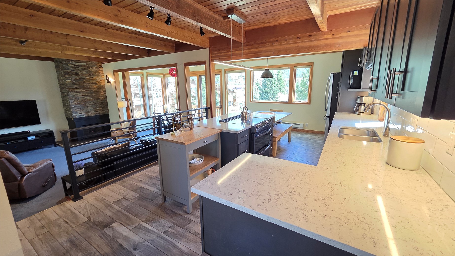 620 Tennis Club Road, Unit 1337 Keystone, CO 80435 - Photo 15 of 48 a view of a dining room with furniture large windows and wooden floor