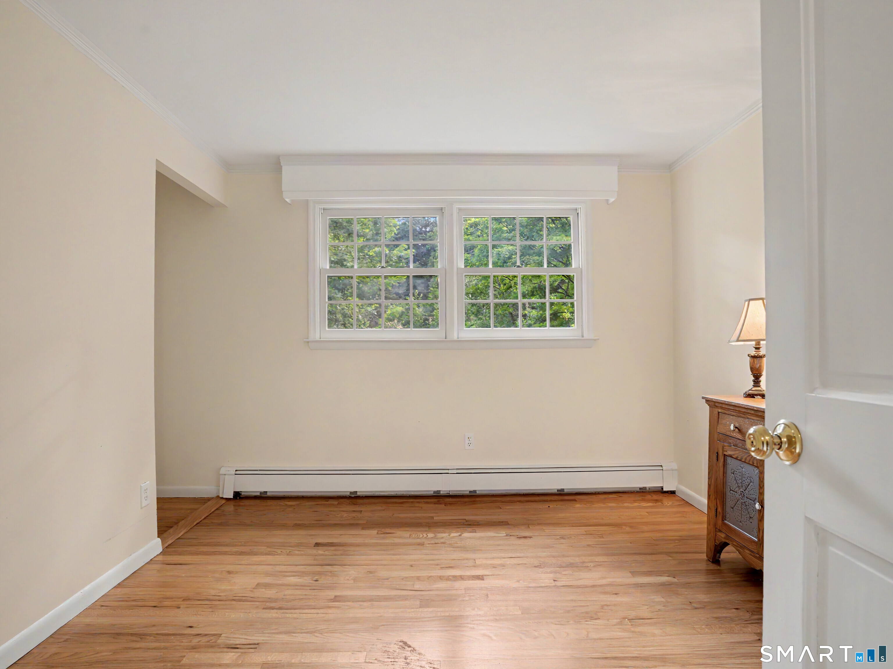 15 Flat Rock Drive Ridgefield, CT 06877 - Photo 20 of 39 an empty room with wooden floor and windows