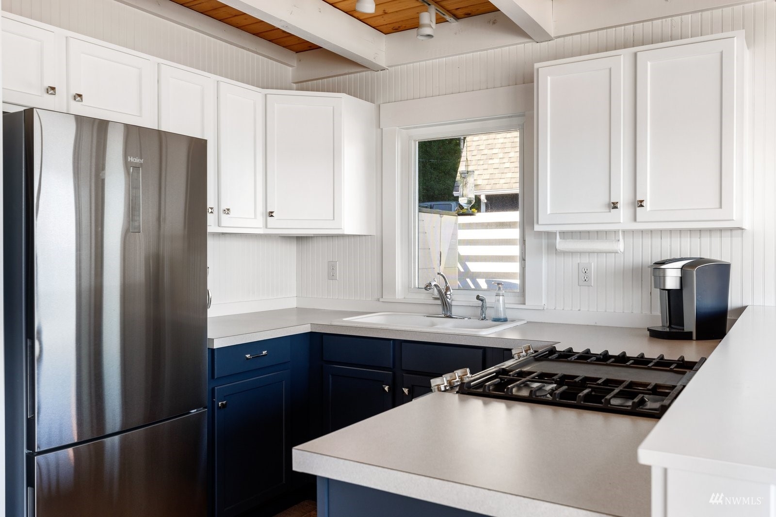 2139 Eastpoint Drive Langley, WA 98260 - Photo 11 of 40 a kitchen with a sink a stove and refrigerator