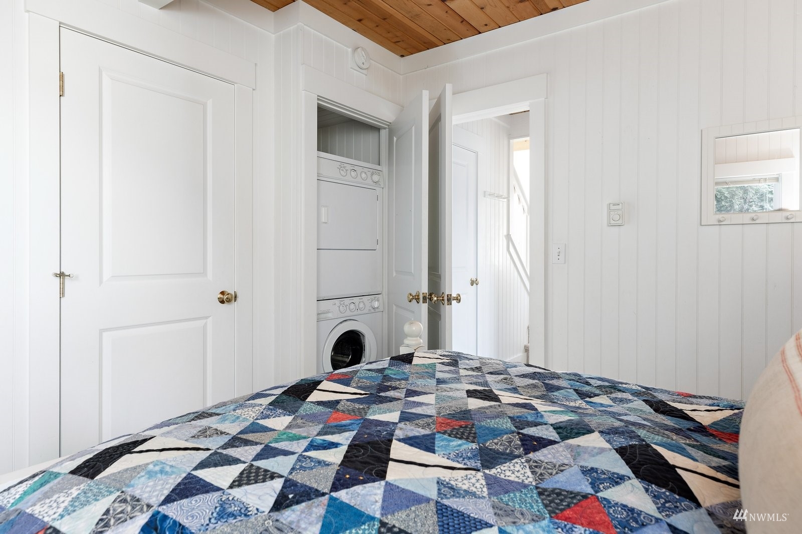 2139 Eastpoint Drive Langley, WA 98260 - Photo 22 of 40 a bedroom with a bed and a window
