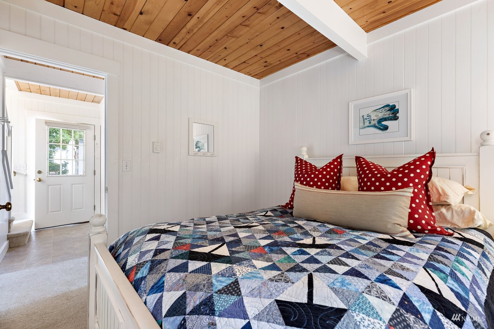 2139 Eastpoint Drive Langley, WA 98260 - Photo 23 of 40 a bed sitting in a bedroom next to a window