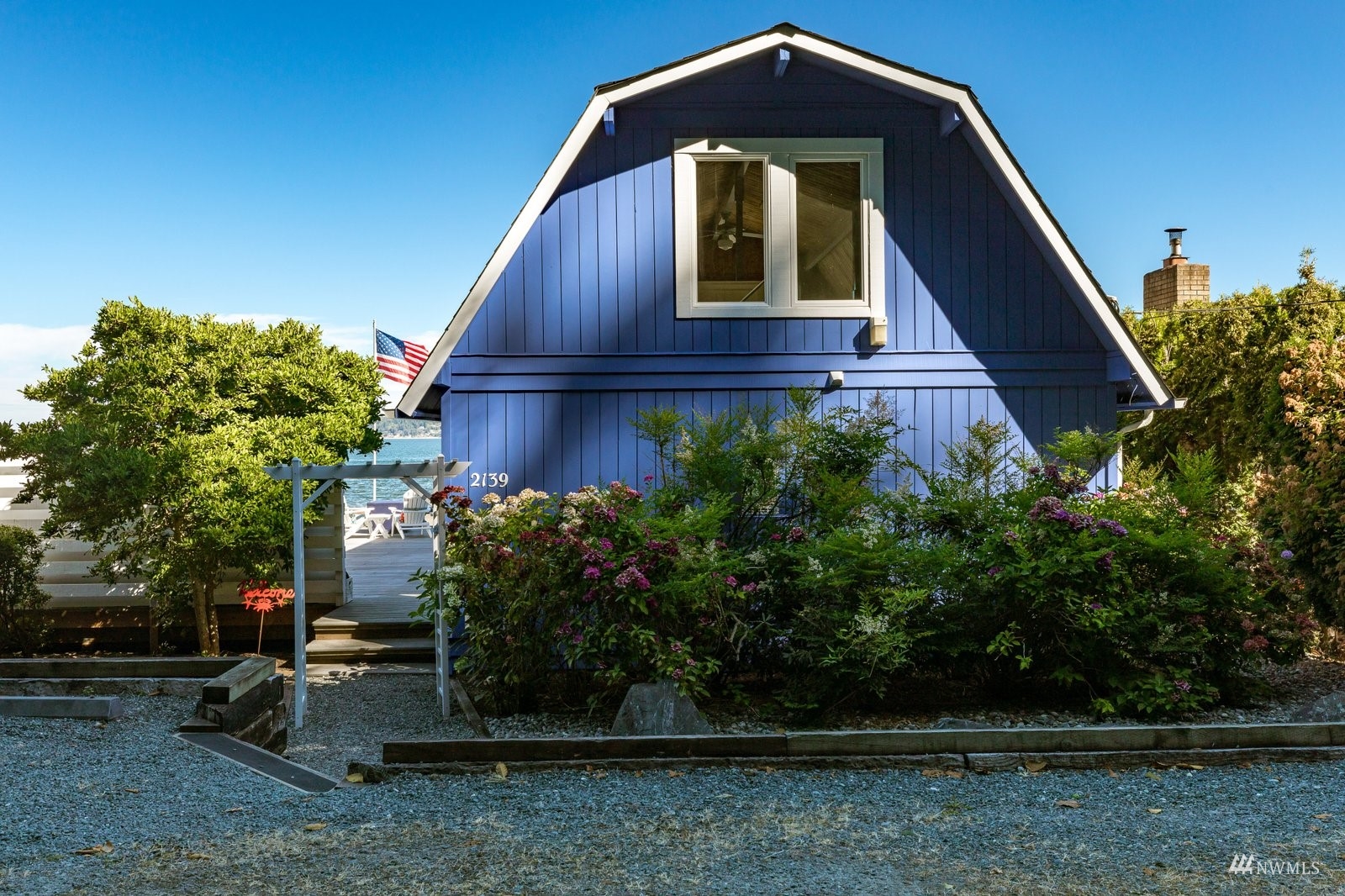 2139 Eastpoint Drive Langley, WA 98260 - Photo 3 of 40 a front view of a house with garden