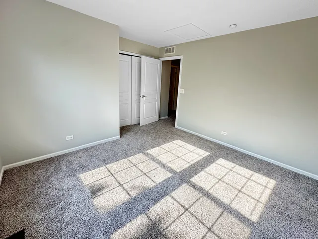 a view of empty room with windows