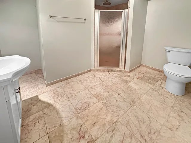 a view of a backyard with sitting area