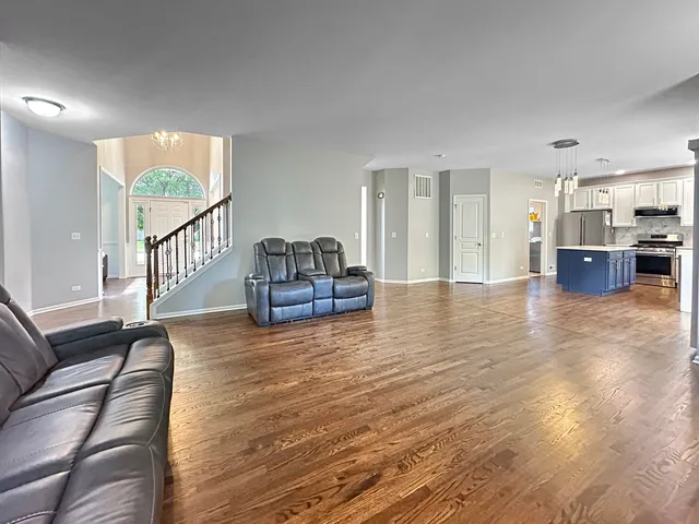 a kitchen with stainless steel appliances granite countertop a stove and a refrigerator