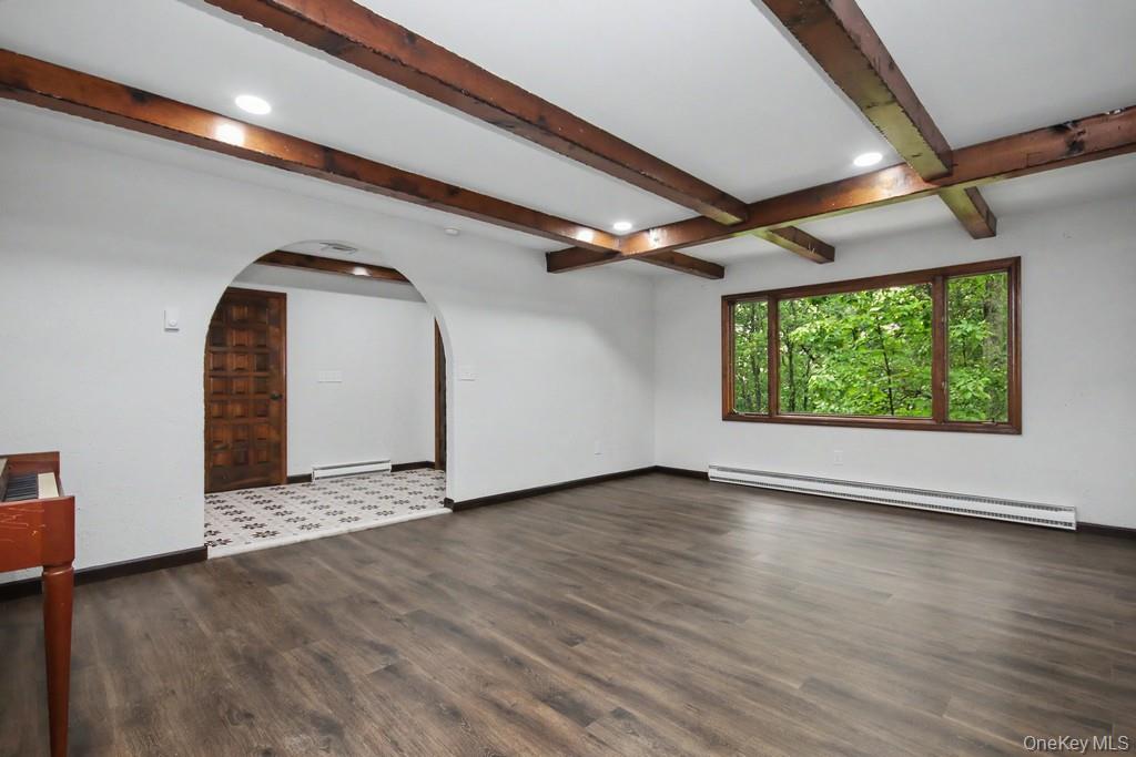 18 Hillside View Road Mahopac, NY 10541 - Photo 13 of 42 an empty room with wooden floor and windows