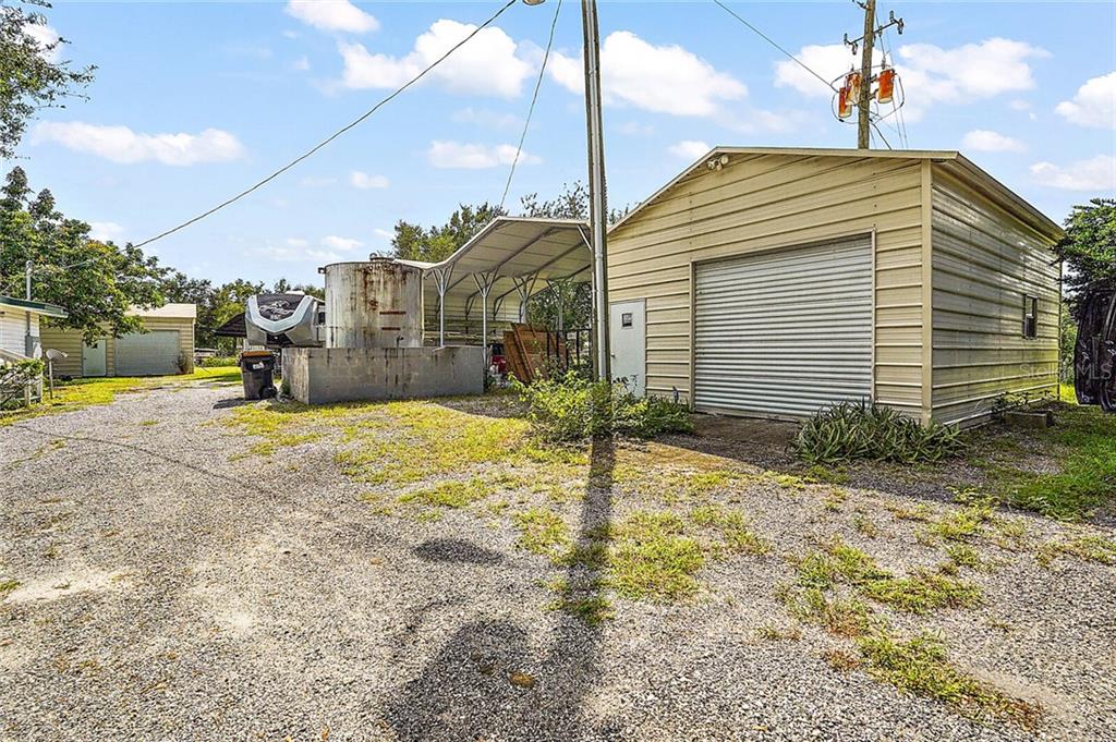 4422 Round Lake Road Apopka, FL 32712 - Photo 32 of 37 2 of 3 out building next to a 4 car carport.