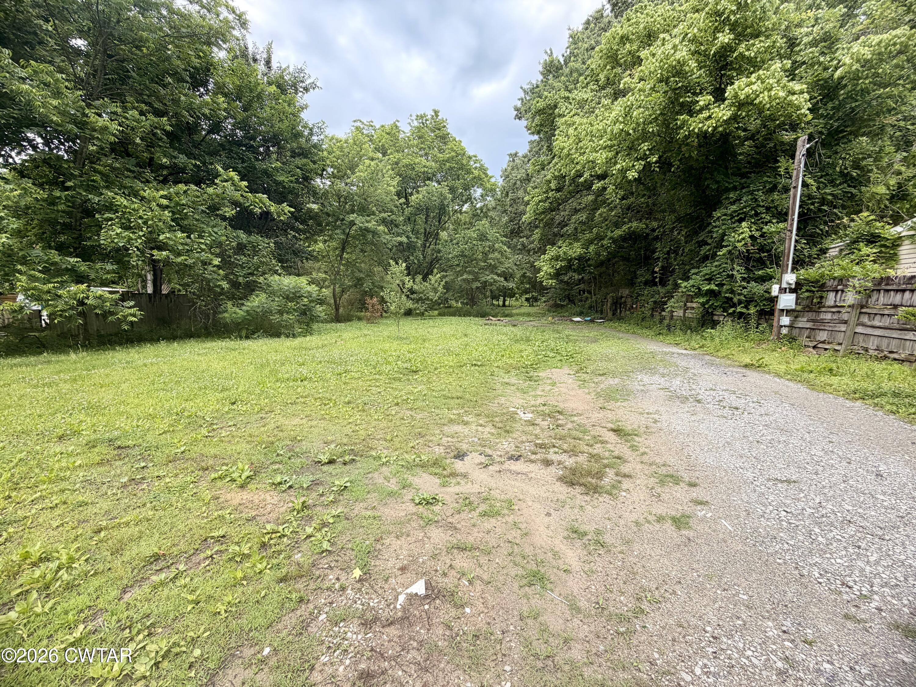 117 Lower Brownsville Road Jackson, TN 38301 - Photo 2 of 3 a view of a field with trees in the background