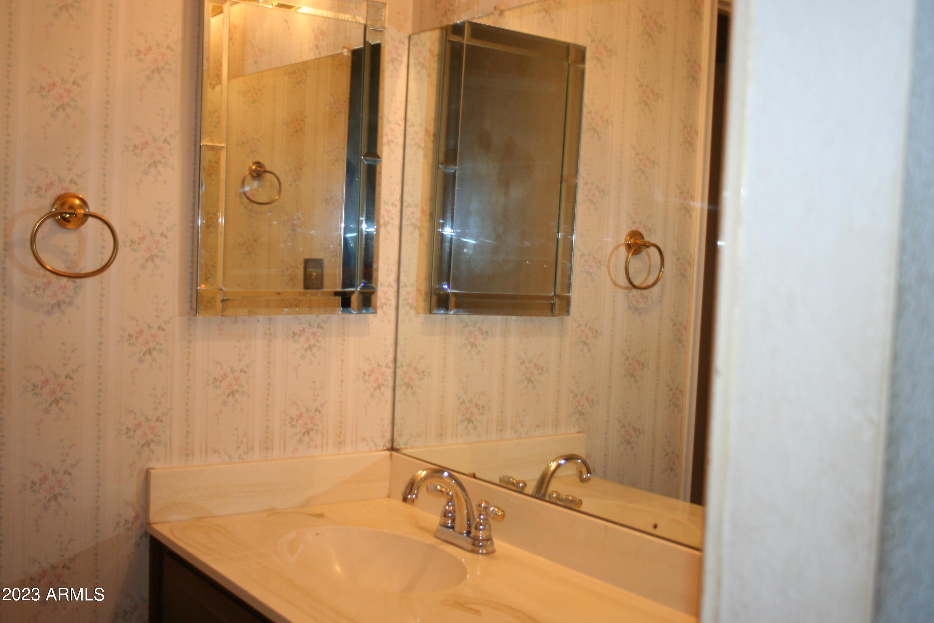 2914 South Price Road Tempe, AZ 85282 - Photo 24 of 30 a bathroom with a sink and a mirror