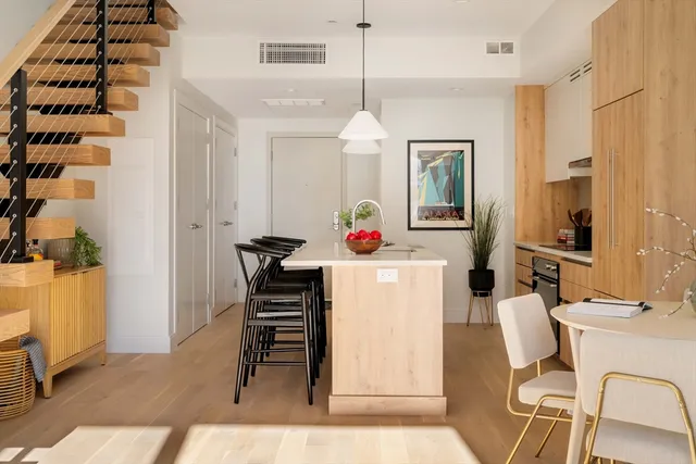 a room with furniture a chandelier and a dining table