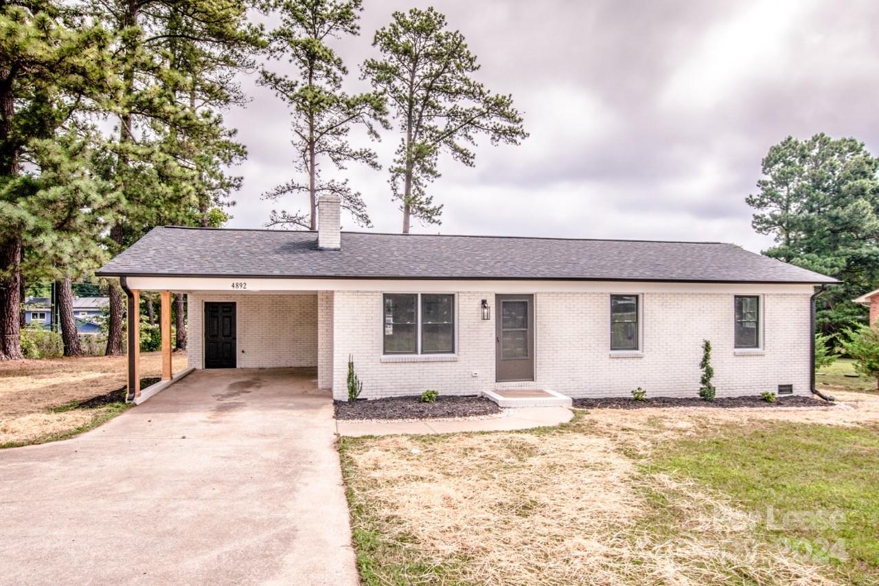 a front view of a house with yard