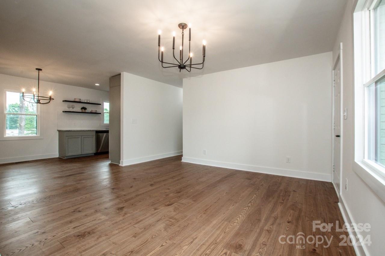 4892 Highway 16 Denver, NC 28037 - Photo 11 of 46 wooden floor in an empty room with a window