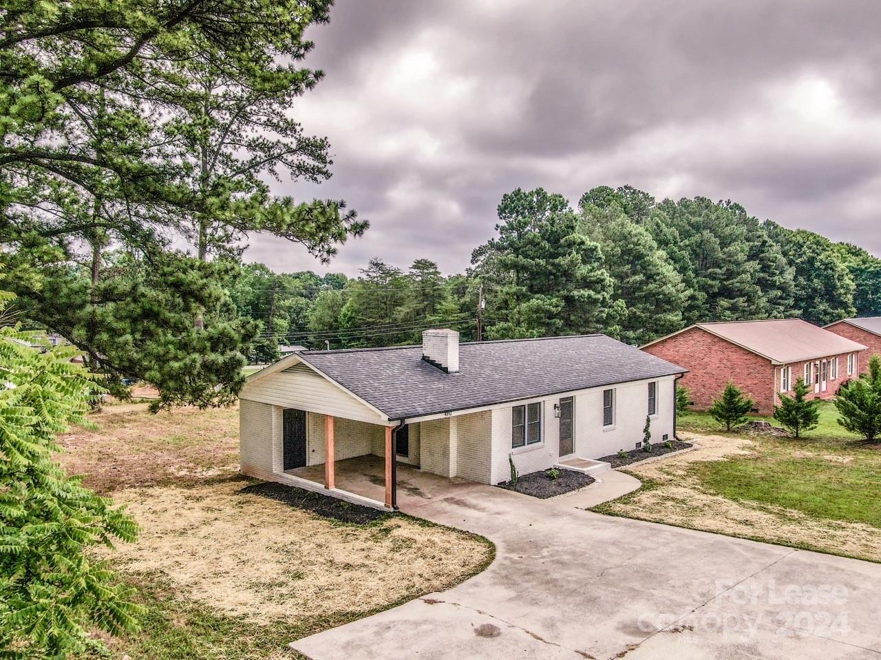 4892 Highway 16 Denver, NC 28037 - Photo 41 of 46 a view of a house with a yard