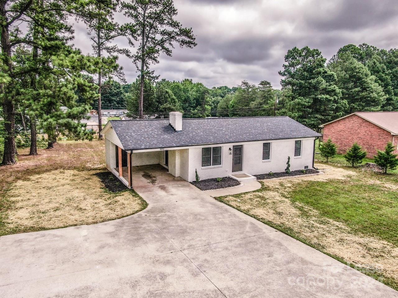 4892 Highway 16 Denver, NC 28037 - Photo 44 of 46 front view of a house with a yard