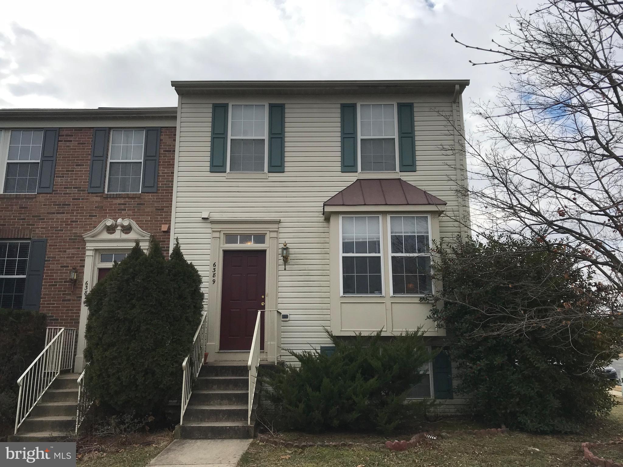 6389 Trips Way Springfield, VA 22150 - Photo 1 of 22 a front view of a house with a yard