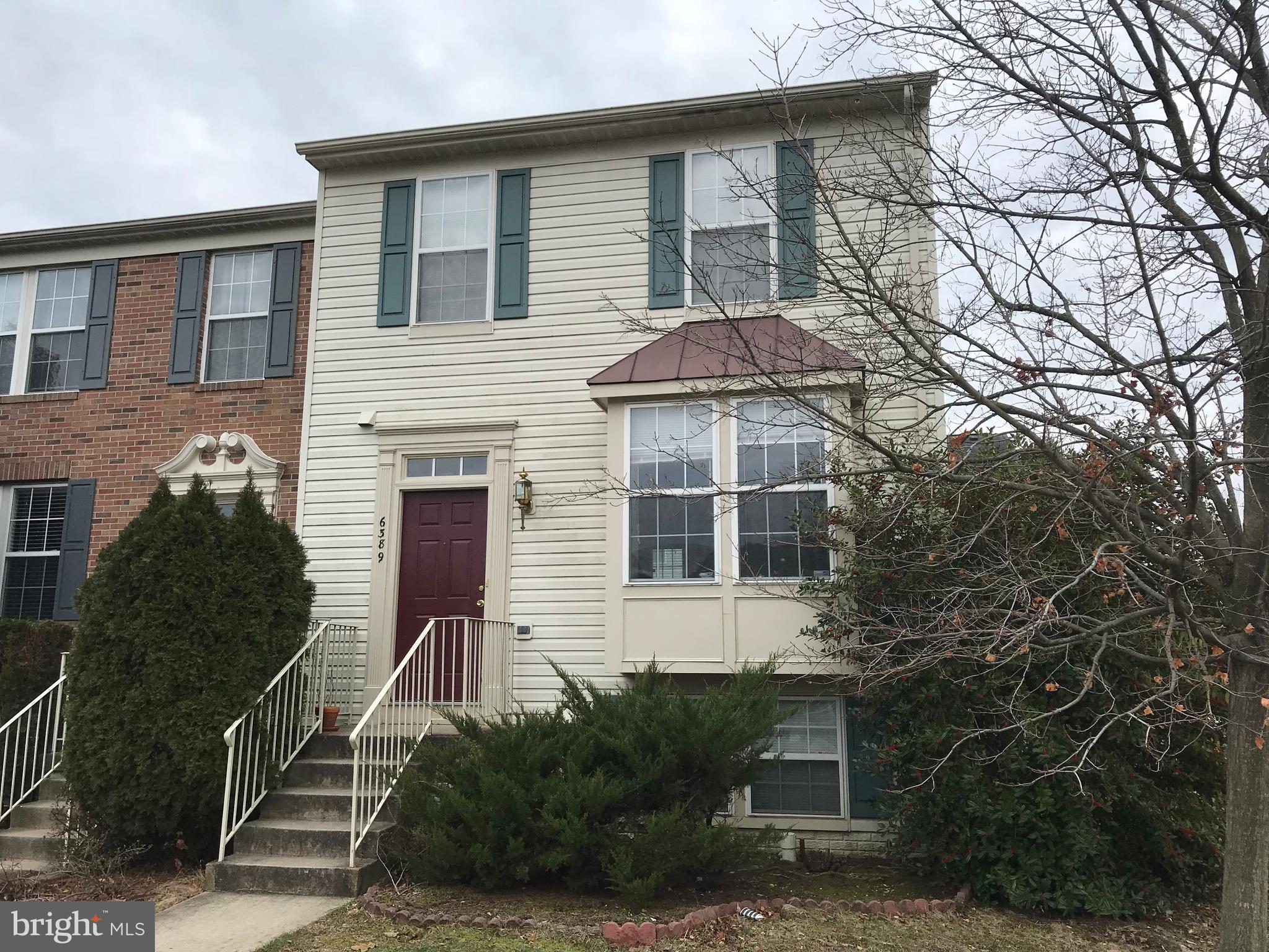 6389 Trips Way Springfield, VA 22150 - Photo 2 of 22 a front view of a house with a yard