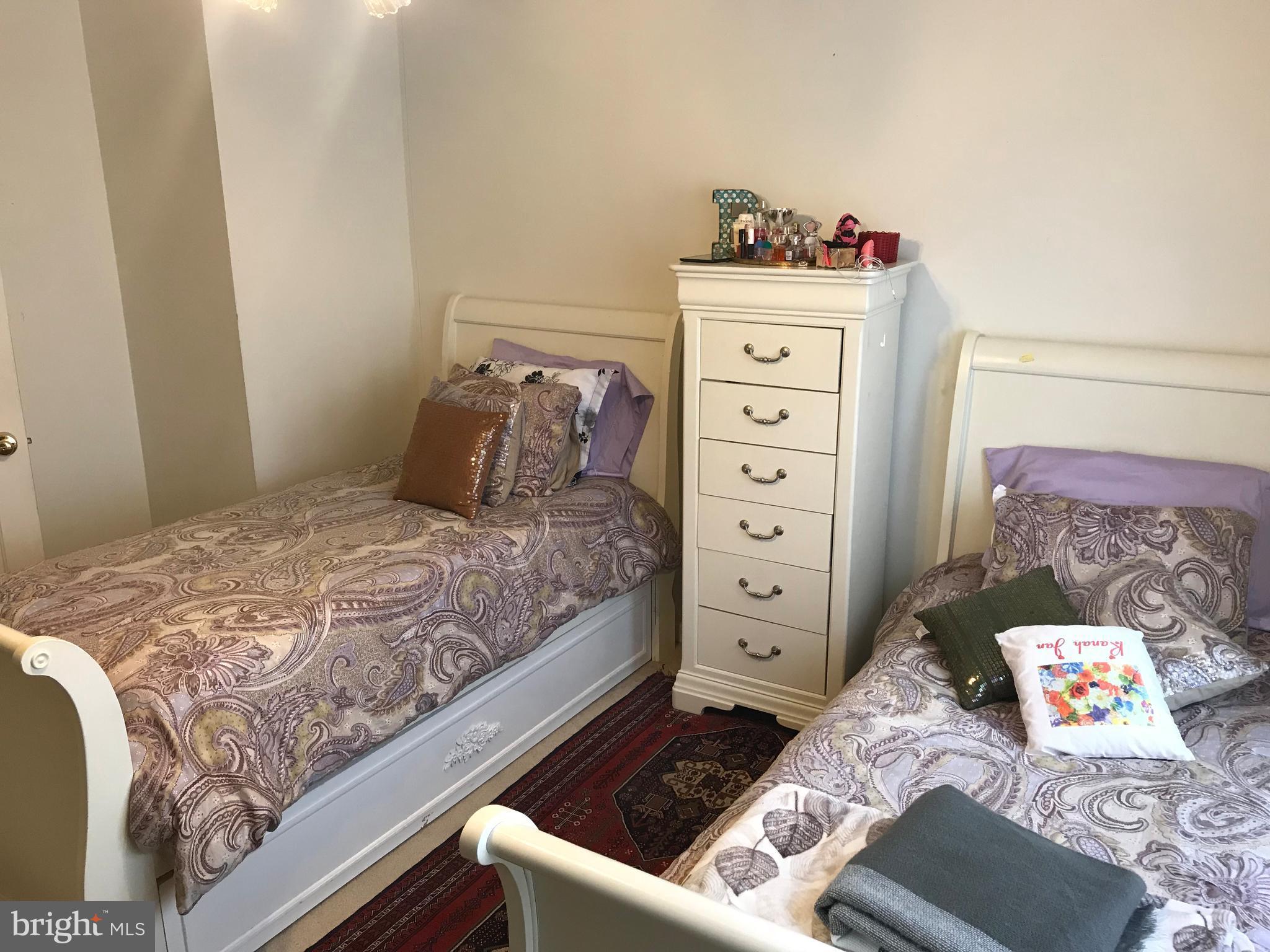 6389 Trips Way Springfield, VA 22150 - Photo 15 of 22 a bedroom with a bed and with furniture