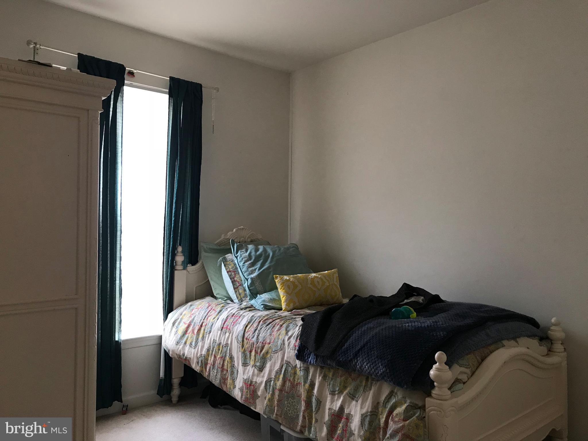 6389 Trips Way Springfield, VA 22150 - Photo 16 of 22 a bedroom with a bed and a window