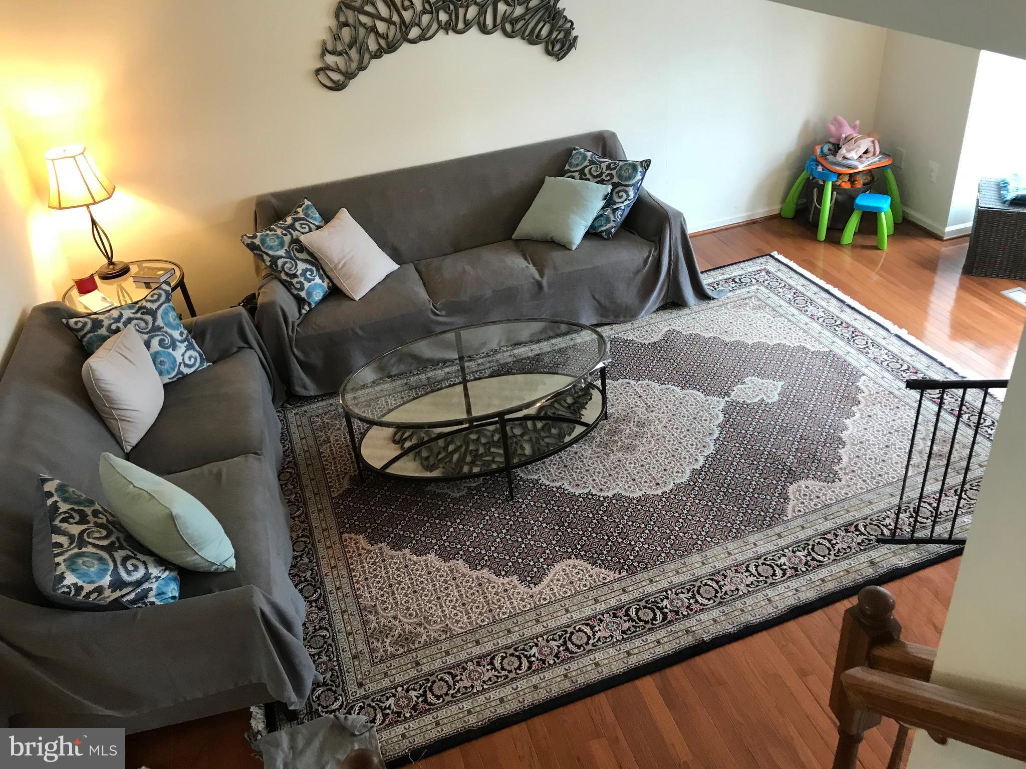 6389 Trips Way Springfield, VA 22150 - Photo 5 of 22 a living room with furniture and a couch