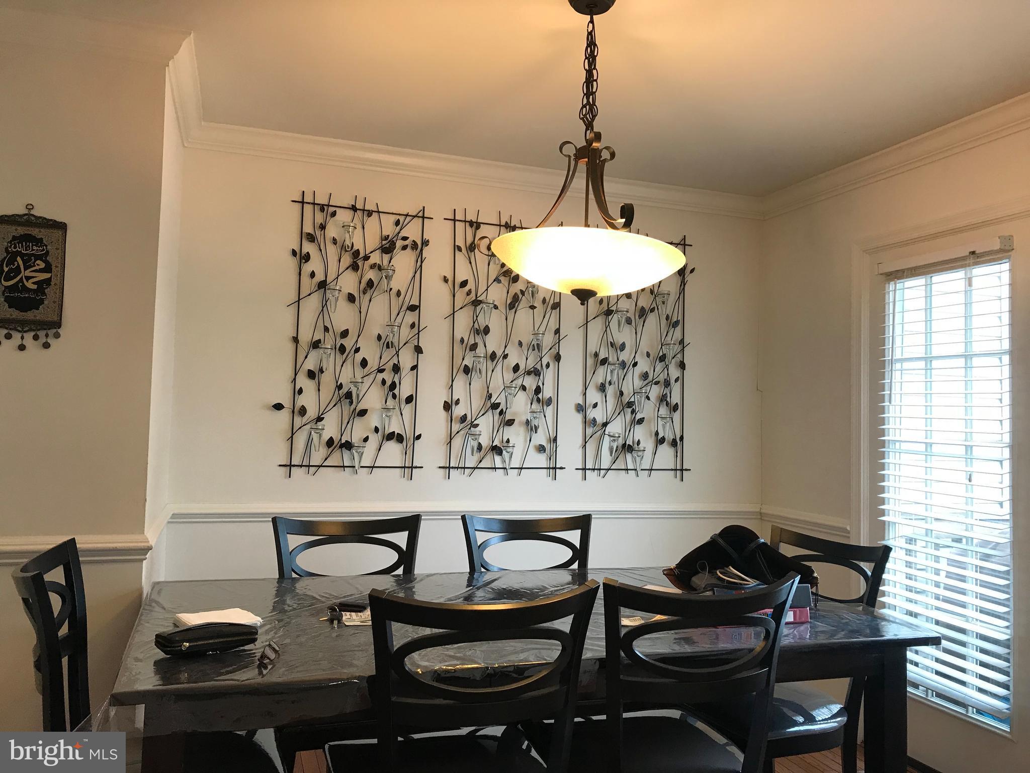 6389 Trips Way Springfield, VA 22150 - Photo 10 of 22 a workspace with furniture and chandelier