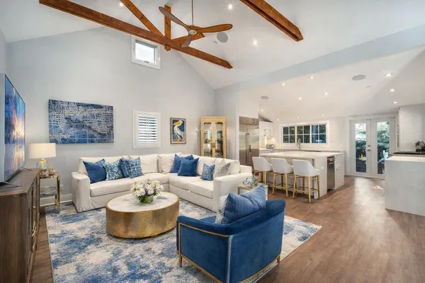 a living room with furniture or outdoor area and a ceiling fan