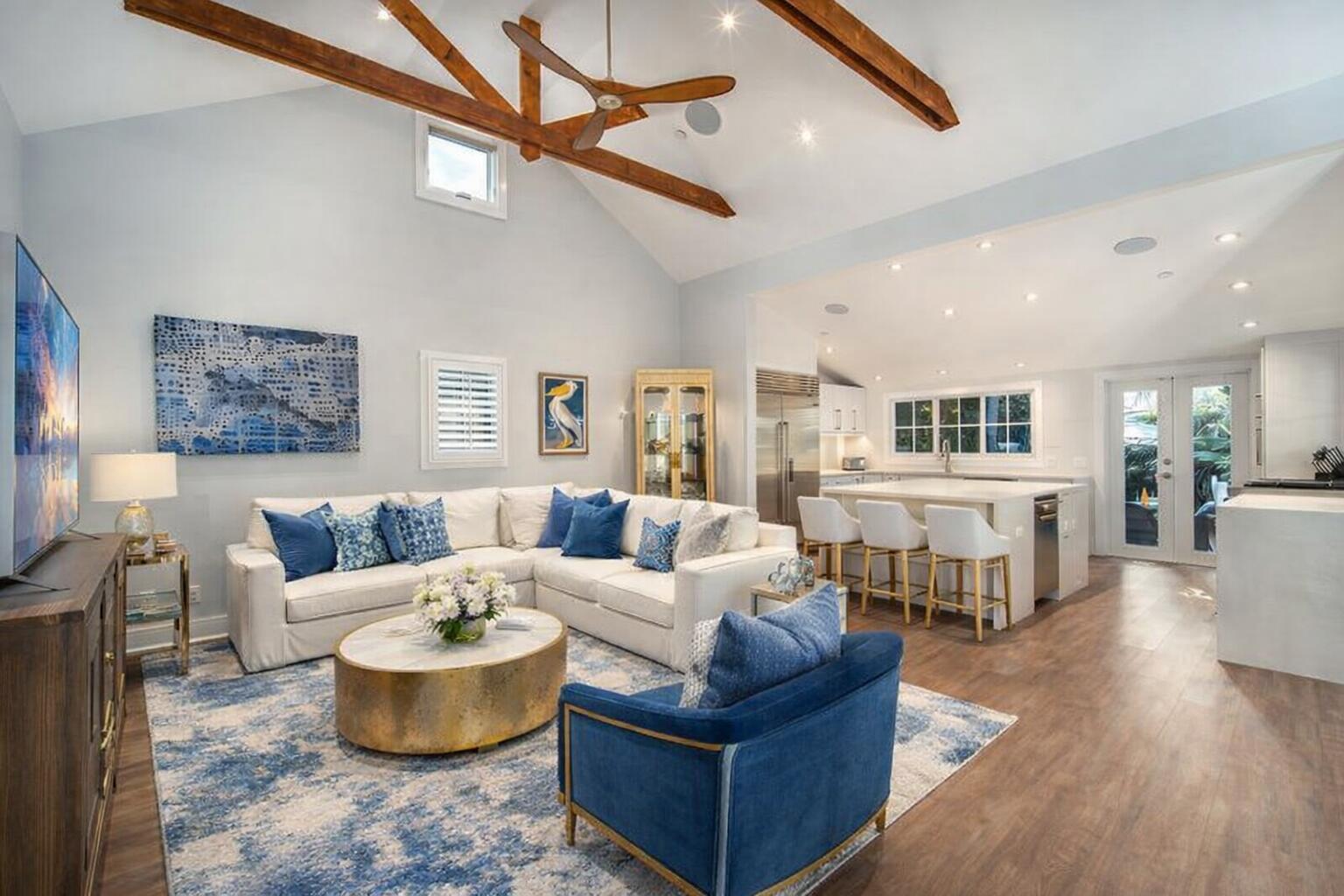 a living room with furniture or outdoor area and a ceiling fan