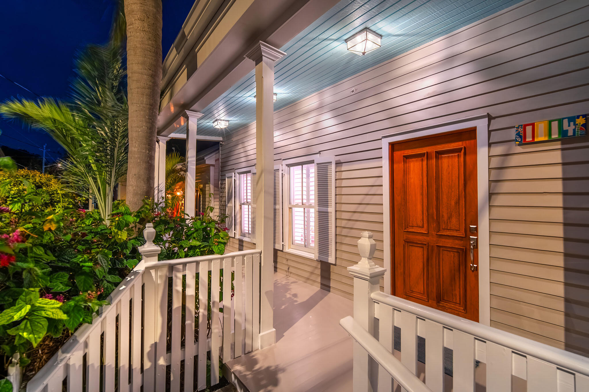 1114 Packer Street Key West, FL 33040 - Photo 47 of 94 a view of a porch with a garden