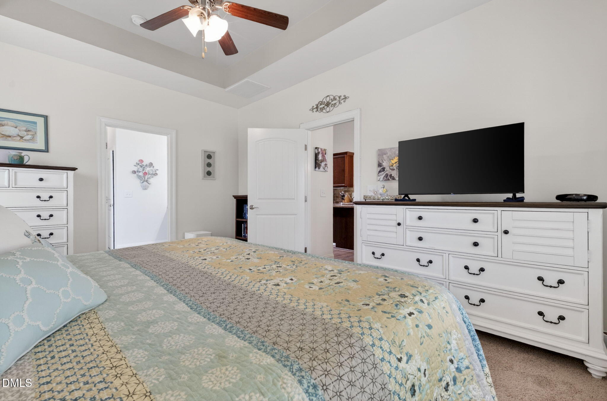 20 Deep Clay Circle Angier, NC 27501 - Photo 28 of 54 a bedroom with a bed and a flat screen tv in white dresser