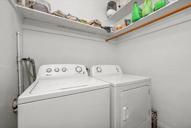 a kitchen with a sink cabinets and wooden floor