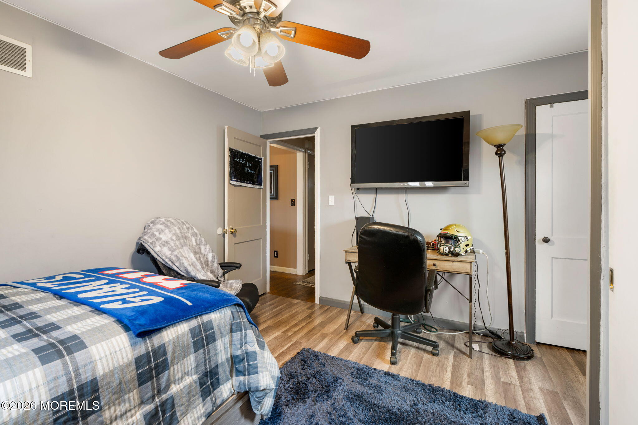 109 Harding Drive Brick, NJ 08724 - Photo 18 of 34 a bedroom with a bed and a flat screen tv