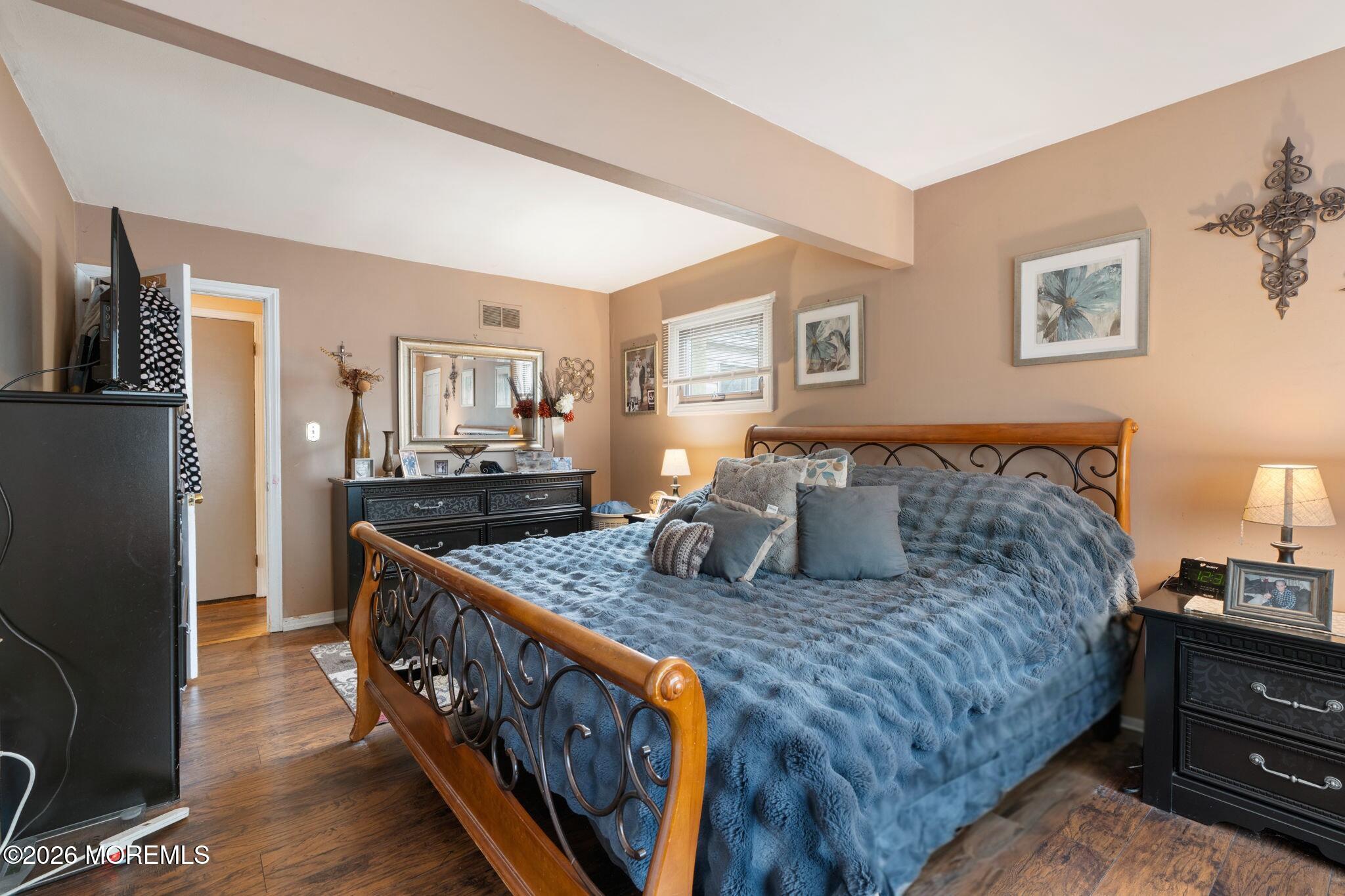 109 Harding Drive Brick, NJ 08724 - Photo 22 of 34 a bedroom with bed and wooden floor