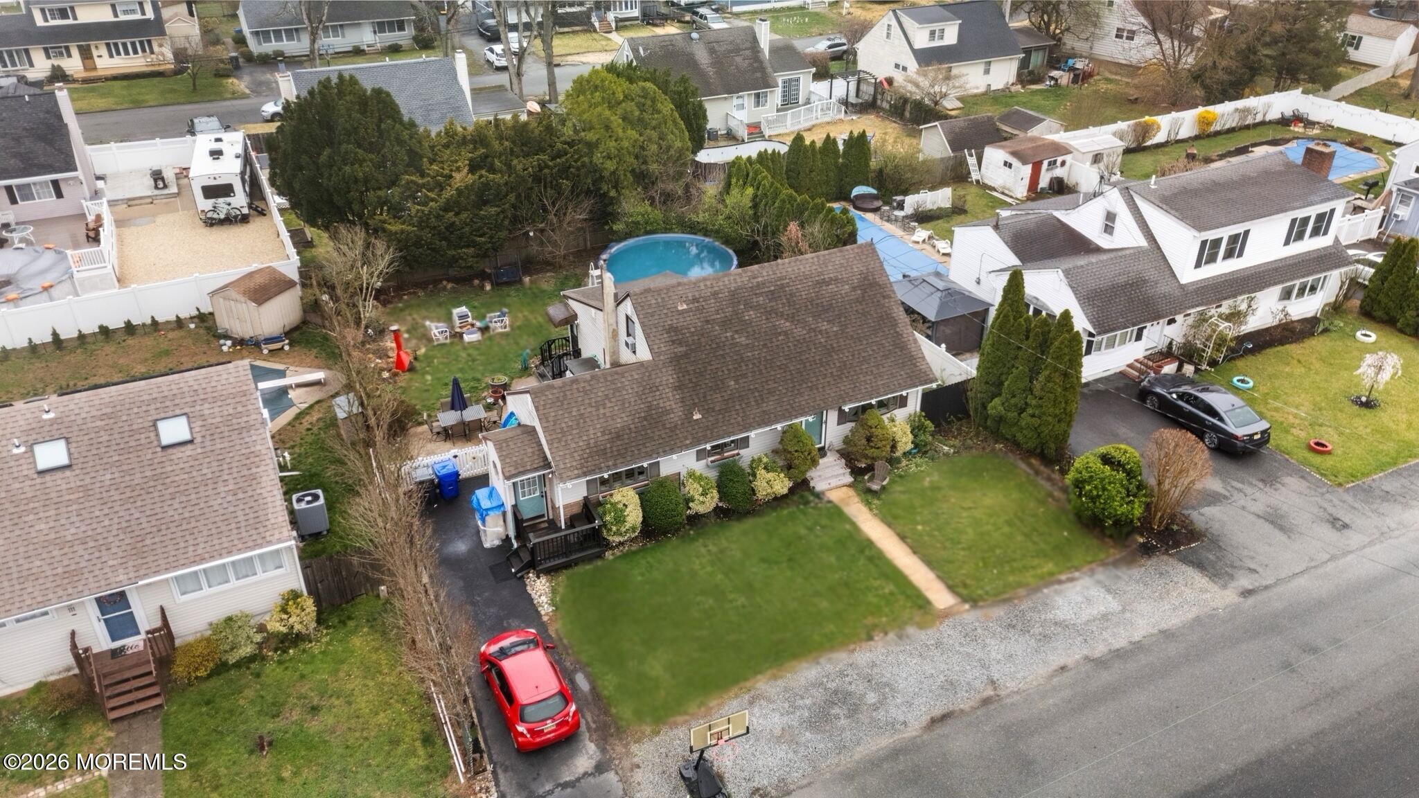 109 Harding Drive Brick, NJ 08724 - Photo 4 of 34 an aerial view of a house with a yard and lake view
