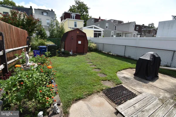 a view of a chair and table on the garden